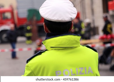 Italian Chief Of Police With Uniform Phosphorescent And White Hat During The Traffic Control Written POLIZIA  Which Means POLICE In Italian