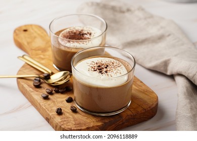 Italian chocolate and coffee mousse dessert semifreddo - half-frozen ice cream with whipped cream and cocoa powder in small glasses - Shutterstock ID 2096118889