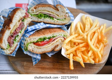 Italian Ciabatta bread sandwich with rucola , tomatoes,salami,mortadella  and  prosciutto  crudo - Shutterstock ID 2227139955