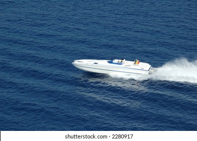 An Italian Cigarette Boat Speeding Across The Mediterranean