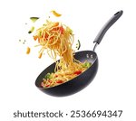 An Italian cooking scene with vegetables flying over a hot skillet is isolated on a white background. Stir-Fried Noodles with Vegetables in a Black Pan on White Background