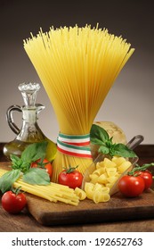 Italian cuisine: Spaghetti bunch, cherry tomatoes and basil l still life