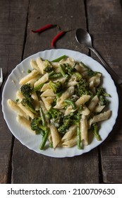 Italian Delicacy Penne Pasta In Cheese Sauce In A Plate. Top View.