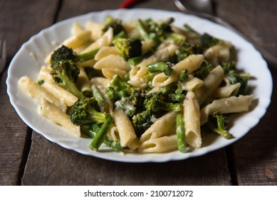 Italian Delicacy Penne Pasta In Cheese Sauce In A Plate. 