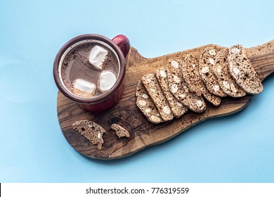 Italian dry cookies cantucci or biscotti with nuts and hot chocolate on a wooden table. A bunch of homemade cookies. Top view - Powered by Shutterstock