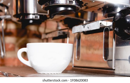 Italian Espresso Machine On A Restaurant Counter Offering Freshly Brewed Coffee In A Small Cup