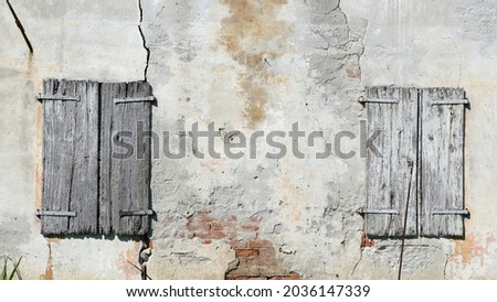 Similar – Background with plastered wall surface, bricks and wooden door