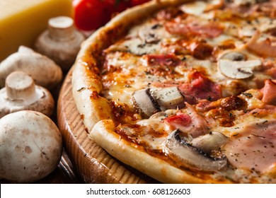 Italian Fast Food. Delicious Hot Pizza Sliced And Served On Wooden Platter With Ingredients, Close Up View. Menu Photo.