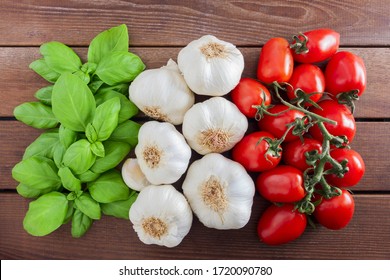 Italian flag from Italian food ingredients: basil, garlic, tomato.