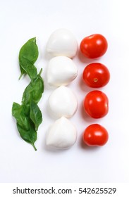 Italian flag made of food concept. Italian caprese salad made of cherry mozzarella, basil leaves and cherry tomatoes on white background.