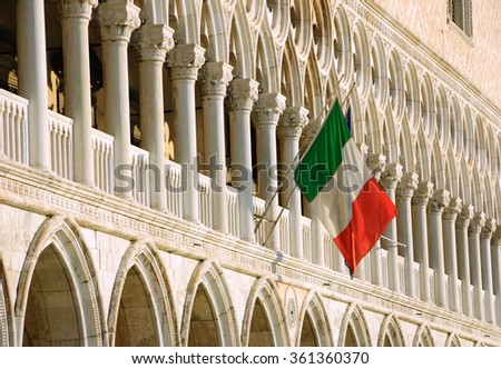 Italian flag on Doge's Palace (Ducal Palace) facade. Venice, Italy.