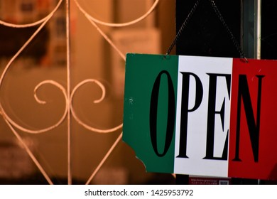 Italian Flag Open Sign Hanging On A Door