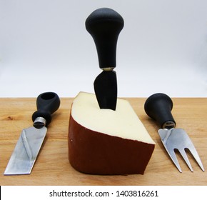 Italian Fontina Cheese On Wooden Table, White Background