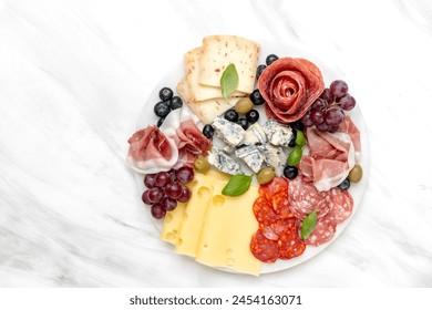 Italian food antipasto prosciutto ham, salami, olives and grissini breadsticks. cheese on a board parmesan, pecorino, gorgonzola. Charcuterie board. elegant serving, banquet cold meat plate - Powered by Shutterstock