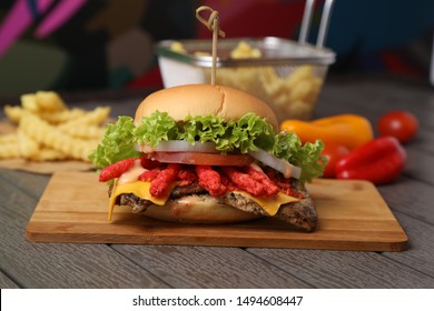 Italian Food Cheetos Chicken Burger With Fries On Wood Table