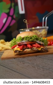 Italian Food Cheetos Chicken Burger With Fries On Wood Table