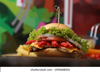 Italian Food Cheetos Chicken Burger With Fries On Wood Table