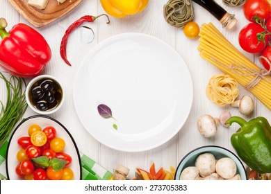 Italian food cooking ingredients. Pasta, vegetables, spices. Top view with copy space - Powered by Shutterstock