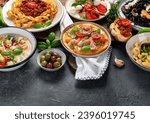 Italian food dishes on dark background. Traditional food concept. Copy space.