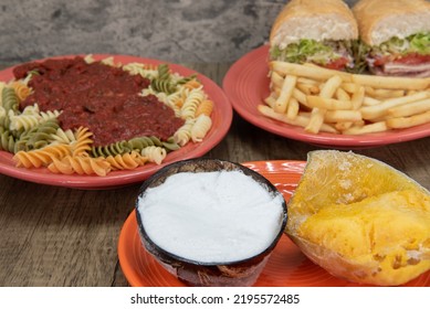 Italian Food Feast Is Set Up On The Table With A Choise Of Pasta In Marinara Sauce, Italian Cold Cut Sandwich, Or Mango And Coconut Ice Cream Dessert.