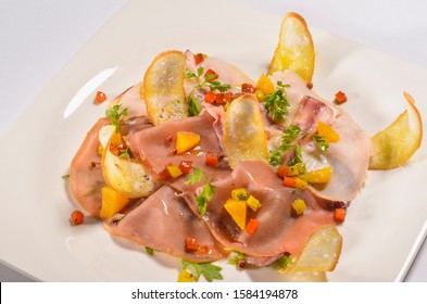 Italian Food Smoked Swordfish, Salmon And Tuna Carpaccio With Citrus Emulsion On White Plate.