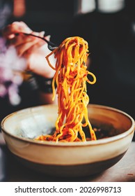 Italian Food. Woman Hand Holding Fork And Knife With Spaghetti Bolognese In Bowl