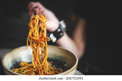 Italian Food. Woman Hand Holding Fork With Spaghetti Bolognese Sauce In Bowl