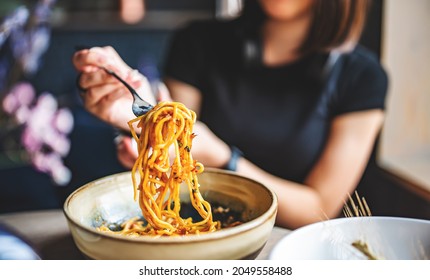 Italian Food. Woman Hand Holding Fork With Spaghetti Bolognese Sauce In Bowl