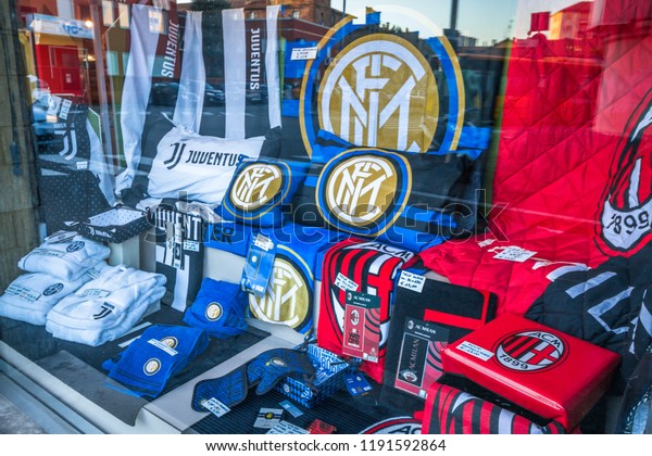 Italian Football\
Team Merchandising Items (Juventus,Inter, Milan) for sale in a Shop\
Window in Rho,\
Milan,Italy