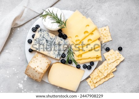 Image, Stock Photo Cheese variety on the wooden cutting board