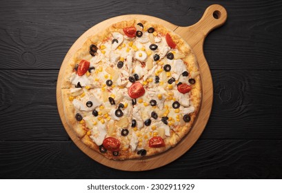 Italian or French pizza with different ingredients. Sausage, meat, cheese, tomatoes. - Powered by Shutterstock