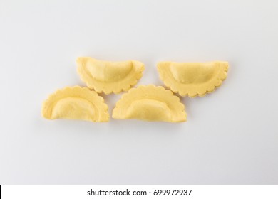 Italian Fresh Ravioli Pasta On White Background. Half Moon Shape