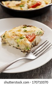 Italian Frittata with slices of tomatoes. Omelette