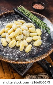 Italian Gnocchi Dumplings, Raw Potato Gnocchi On Plate With Thyme. Dark Background. Top View.