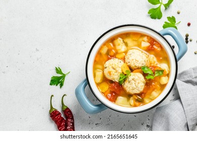 Italian Gnocchi Meatball Soup In Pot. Top View, Copy Space.