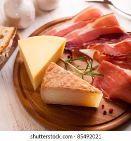 Italian Hard Cheese And Cold Cuts On Kitchen Board