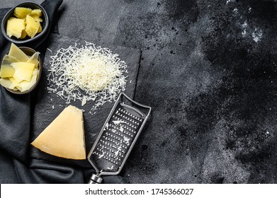 Italian hard Parmesan cheese slice, cut, grated. Black background. Top view. Copy space - Powered by Shutterstock