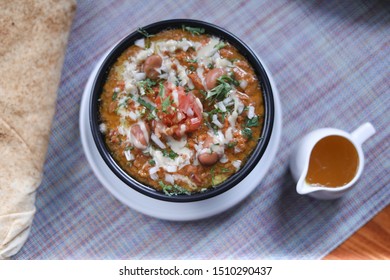 Italian Hot Entrees On Wood Table