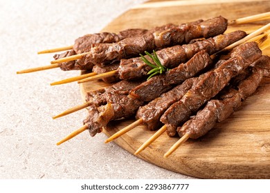  Italian lamb skewers or kebabs cooked on a brazier, with rosemary and spices.  Arrosticini. - Shutterstock ID 2293867777