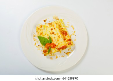 Italian Lasagna Rolls On A White Plate.