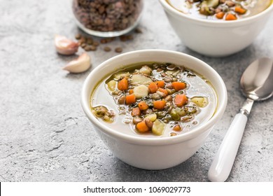 Italian lentil spinach soup. Selective focus, space for text. 