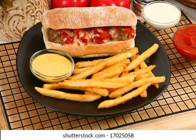 Italian Meatball Sandwich, Spicy Fries And Honey Mustard Sauce.