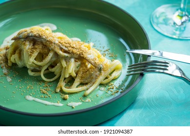 Italian Mediterranean Pasta Spaghetti Linguine With Anchovy, Cheese And Bread - Close Up View