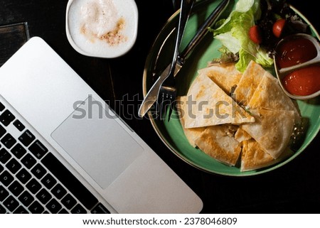 Italian Mozzarella Pizza On black Table, Top View , close up hand and laptop for working