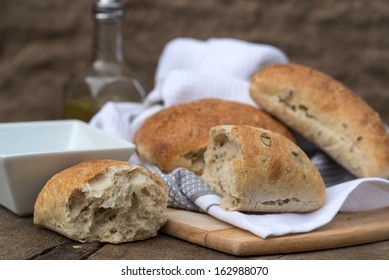 Italian olive bread rolls in rustic kichen setting - Powered by Shutterstock