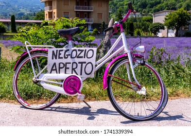 Italian Open Shop Sign On Purple Bike With Lavender Field In The Background (Translation: 