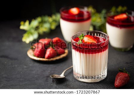 Italian panna cotta dessert with strawberry sirup and mint leaf