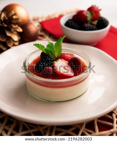 Italian panna cotta with red berries. Blackberries, strawberries and raspberries. Traditional Italian recipe.