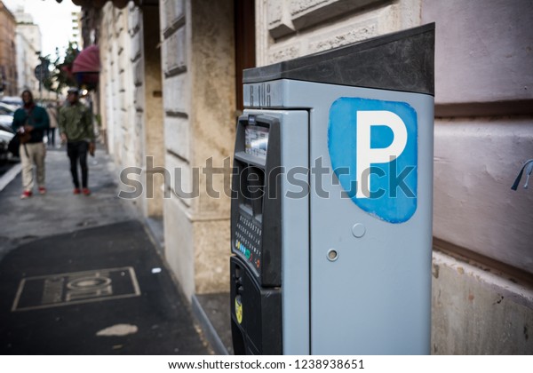 Italian Parking Machine Selling Parking Tickets on\
Blur Background. Rome,\
Italy