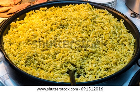 Italian pasta close up. large frying pan of macaroni